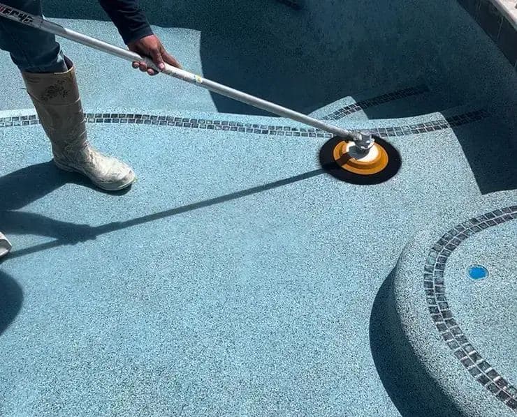 Crew finishing a pebble surface