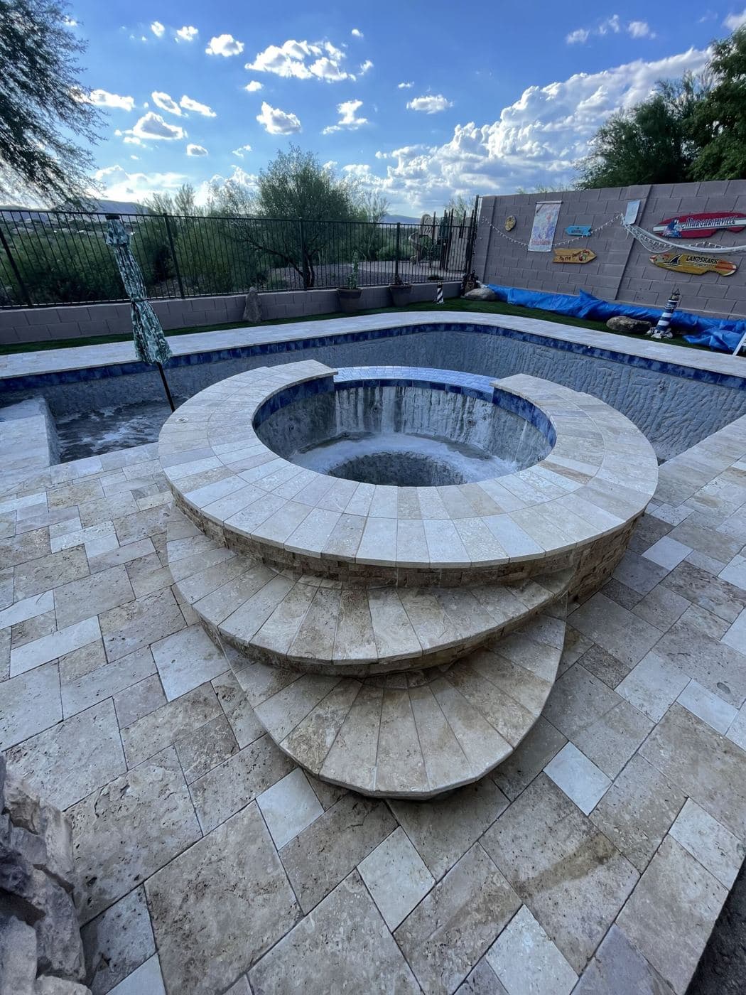 Tile and finish details on a round spa and steps